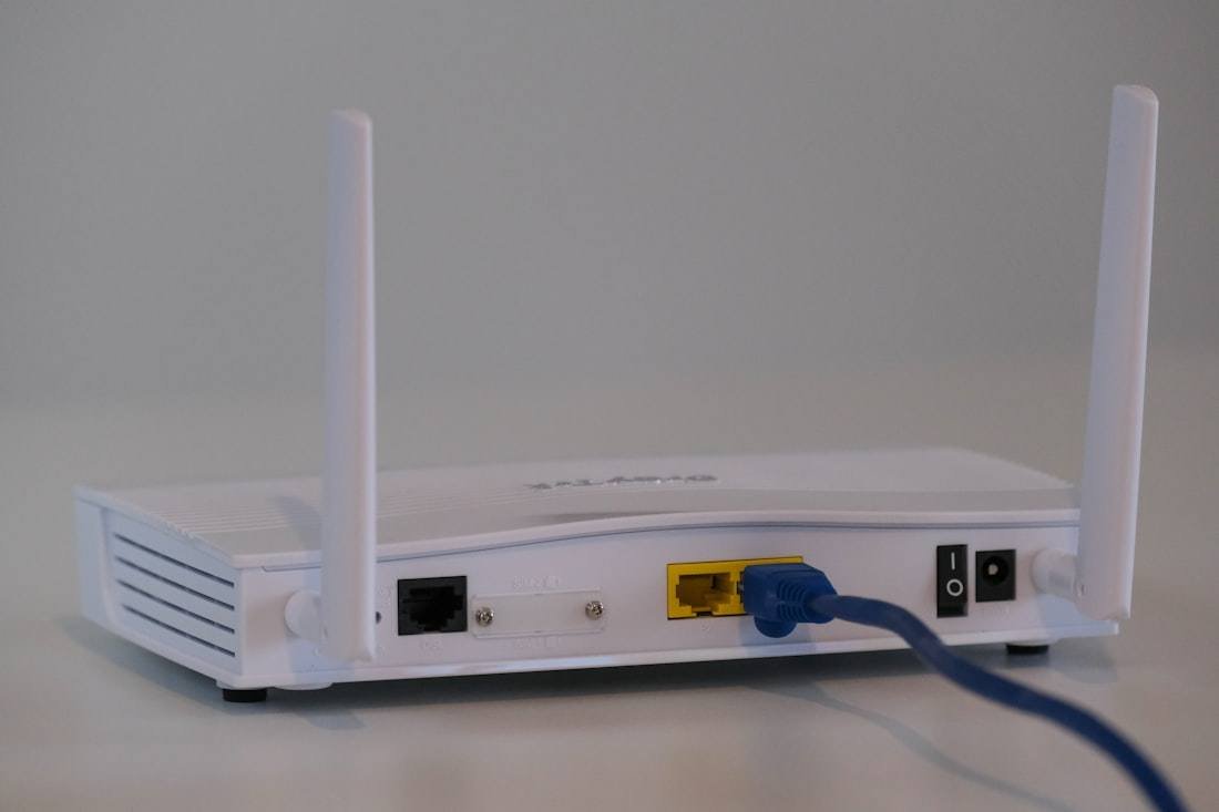 White WiFi router set up at home